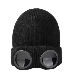 Schwarze Strickmütze mit großer runder Brillen-Optik am Umschlag