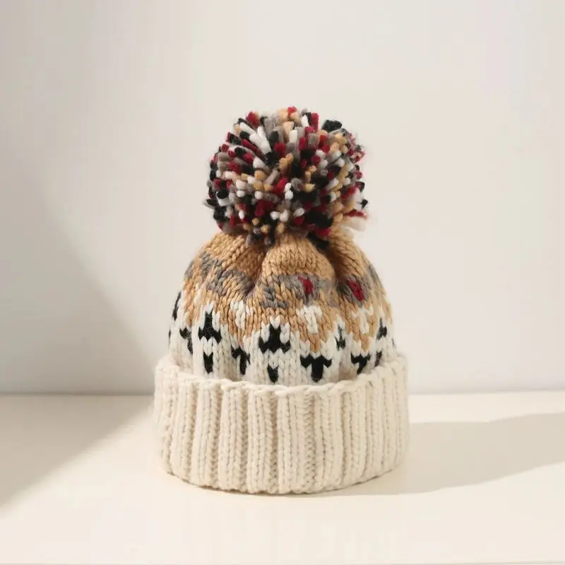 Mütze mit Bommel Damen, gemustert, breiter Umschlag – Creme