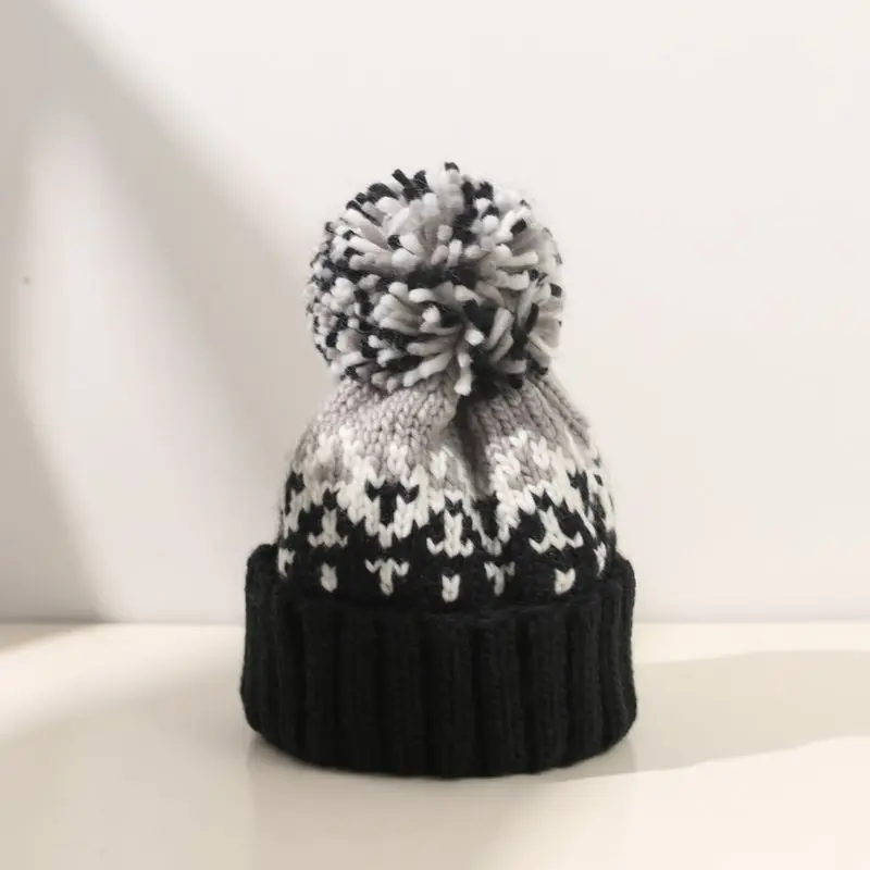 Mütze mit Bommel Damen, gemustert, breiter Umschlag – Schwarz